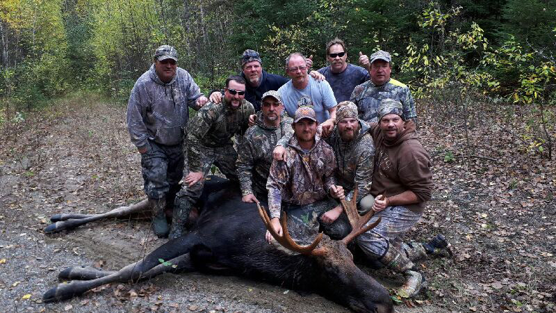 Group Of Moose Hunter With Moose