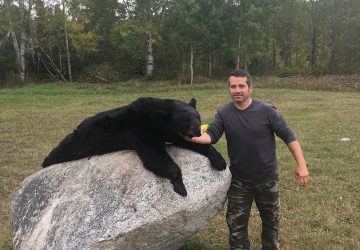 Man With Hunted Black Bear